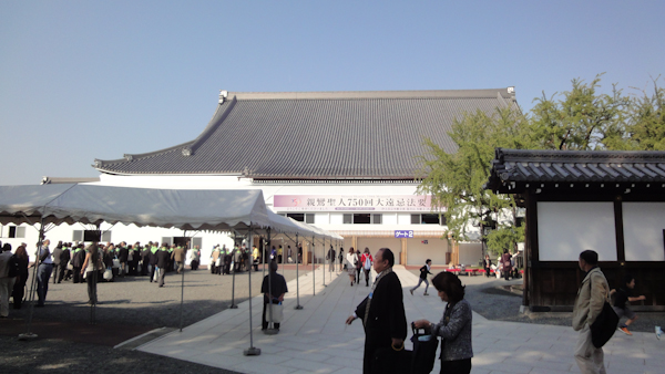 temple building from a distance with a crowd gathering